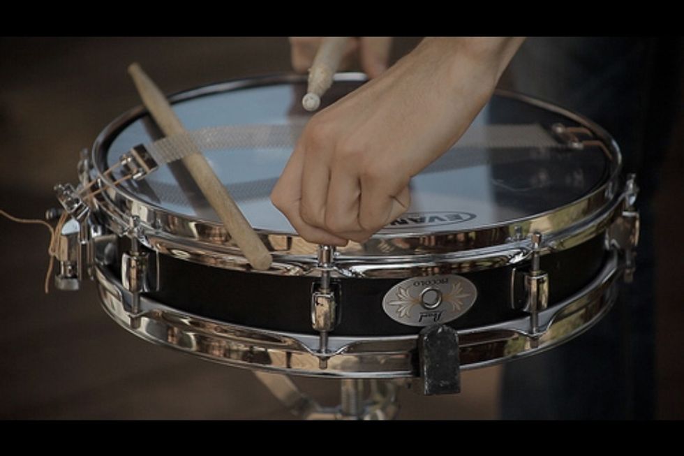 Match the tones that the corners make. You'll have to listen closely. Once your finished tuning, play the drum to hear if it sounds right. It's normal to play around with tuning.