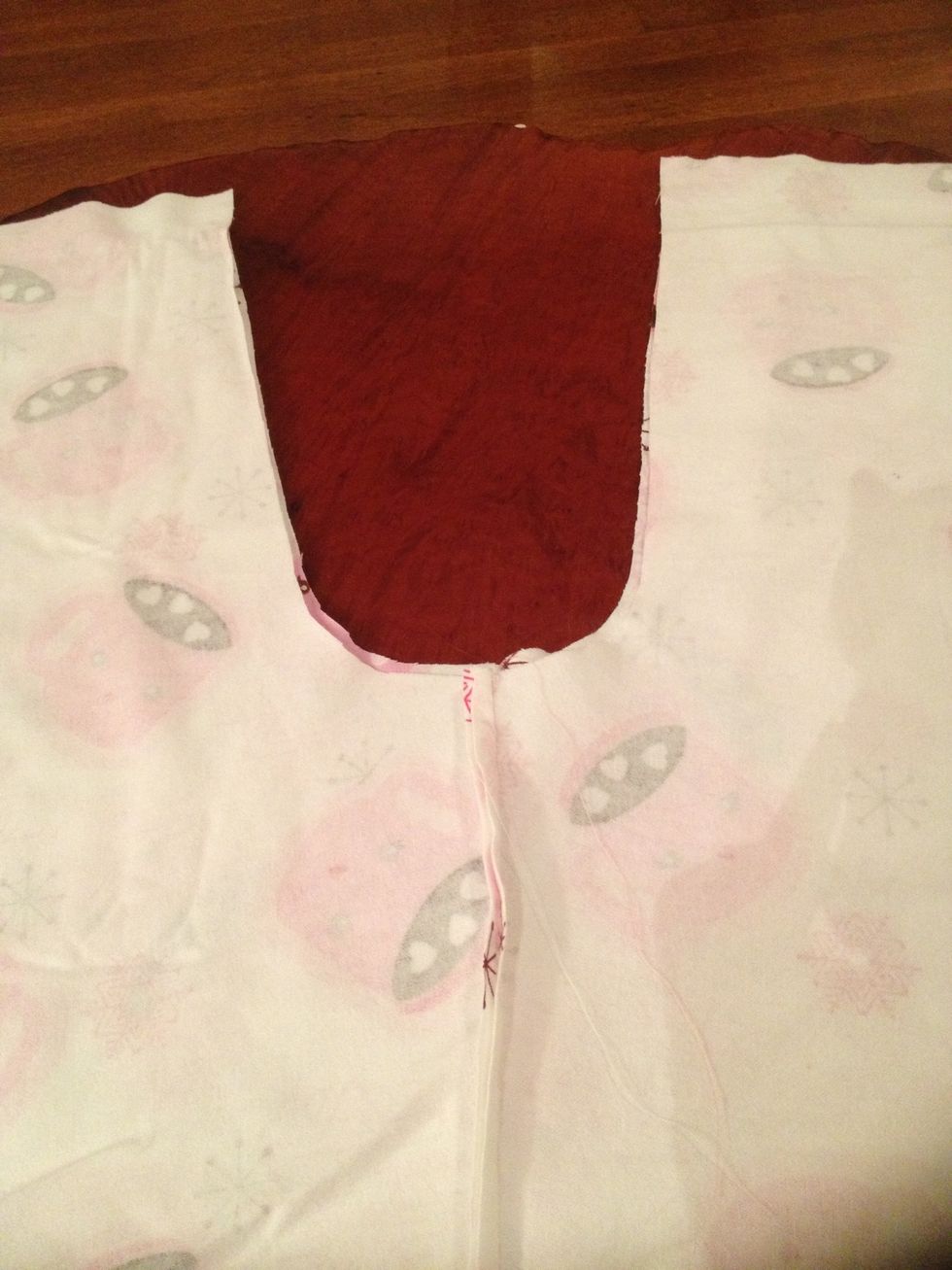 Matching up the 2 seams you just made, place the back of the Jammie pants onto the front with the cute side of the fabric on the inside.