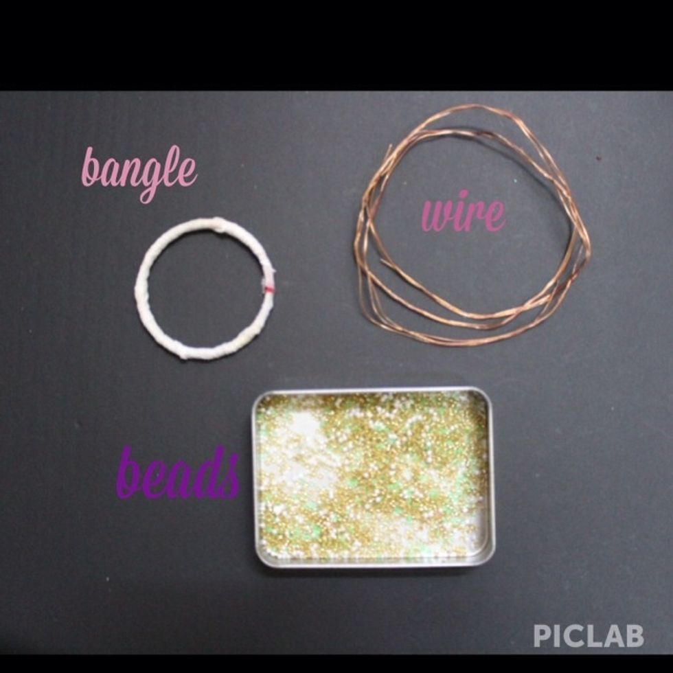 Materials... Ps:Make sure that the bangle you are using is really big because once u finish making it the area inside the bangle becomes narrow.(hope u understood.)