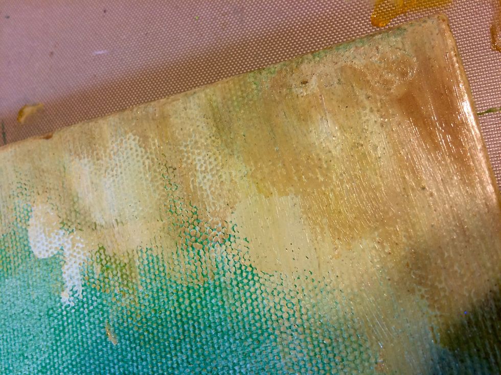 Mayan Gold Velvet, Immaculate Minx Shimmering Inks and Decadent Minx Shimmering Inks rubbed into the upper right corner of the canvas.
