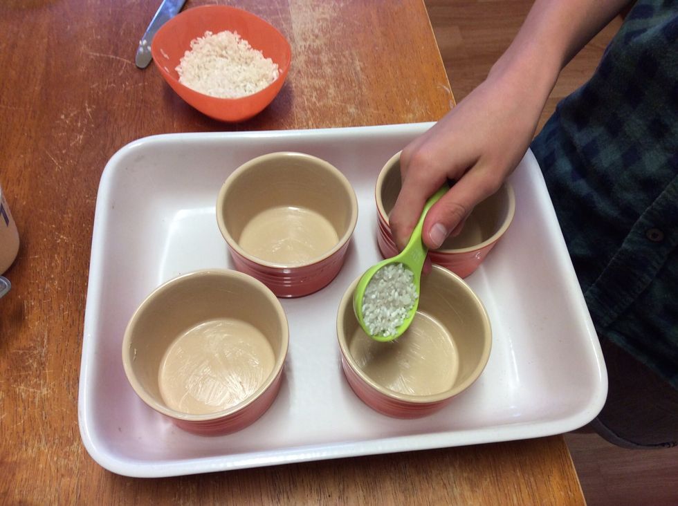 Me putting the rice in to the ramekins