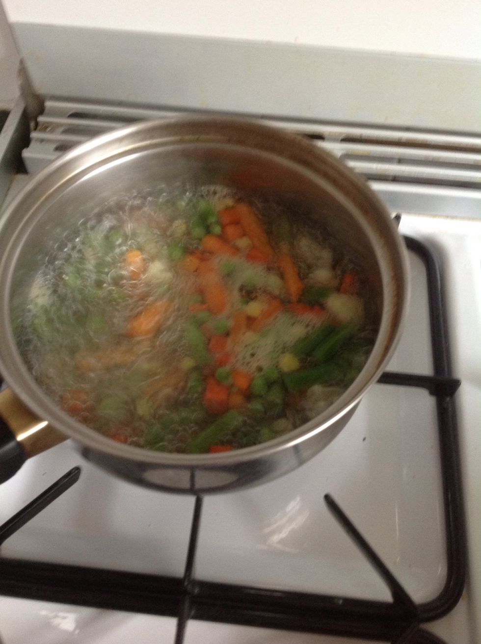 Mean while boil ur veg.(i boiled mines because they were frozen) if its fresh you can just add it in