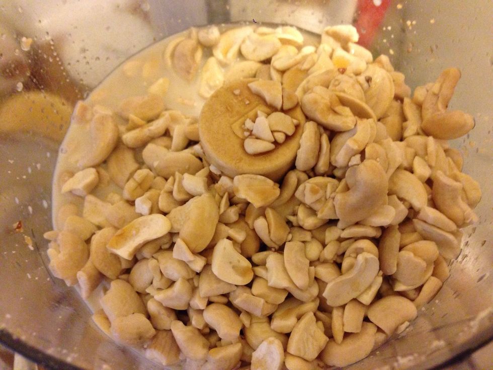Meanwhile, add cashews, maple syrup, liquified coconut oil, sprinkle of salt, and a splash of vanilla extract and process for several minutes until smooth.
