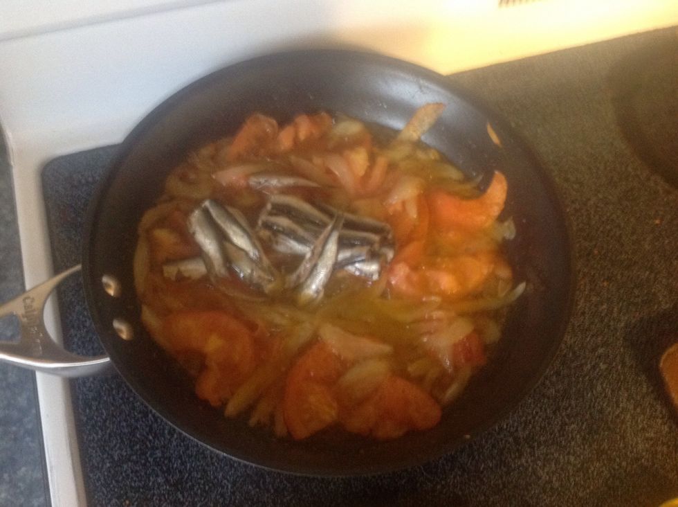 Meanwhile add the sardines to the stew and chop into pieces and mix.