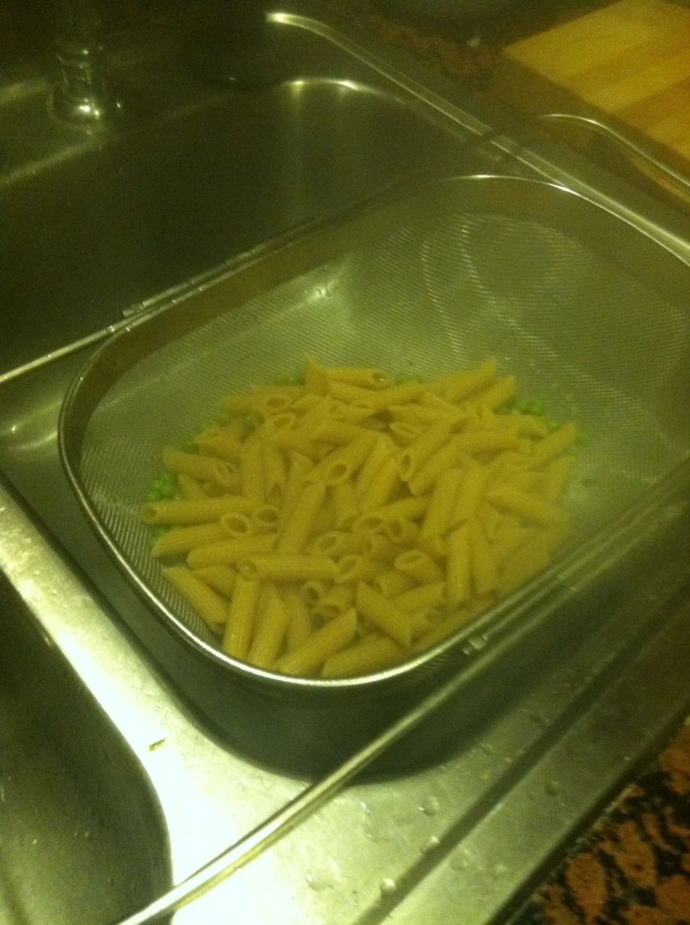 Meanwhile, after the peas have been in with the pasta for 30 seconds or so (which should also be a minute or two before the pasta is finished cooking to your liking), drain the pasta and peas.