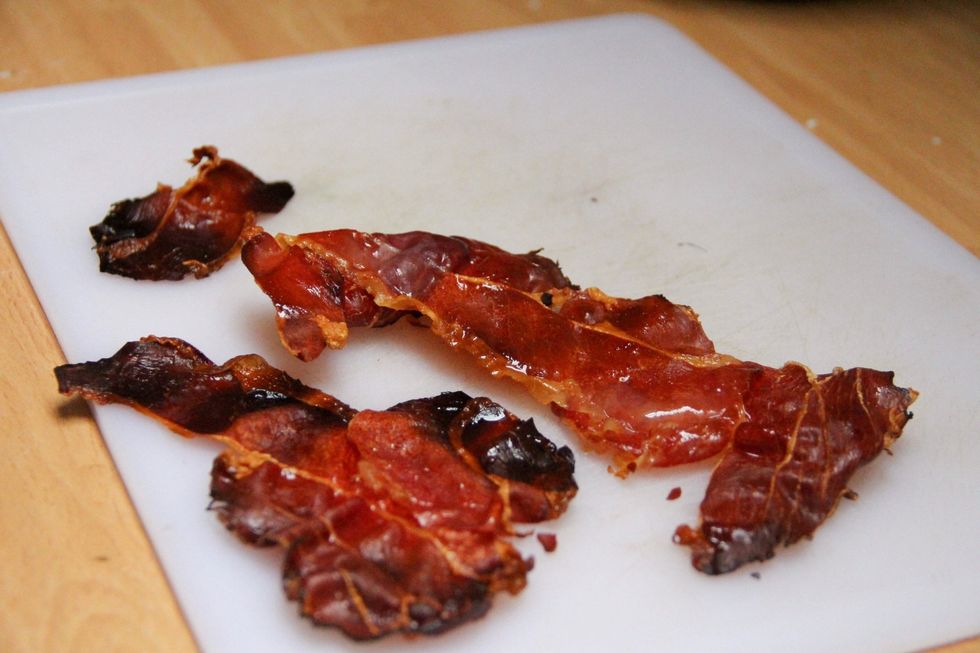Meanwhile bake a few slices of prosciutto in the oven on some baking paper till crispy