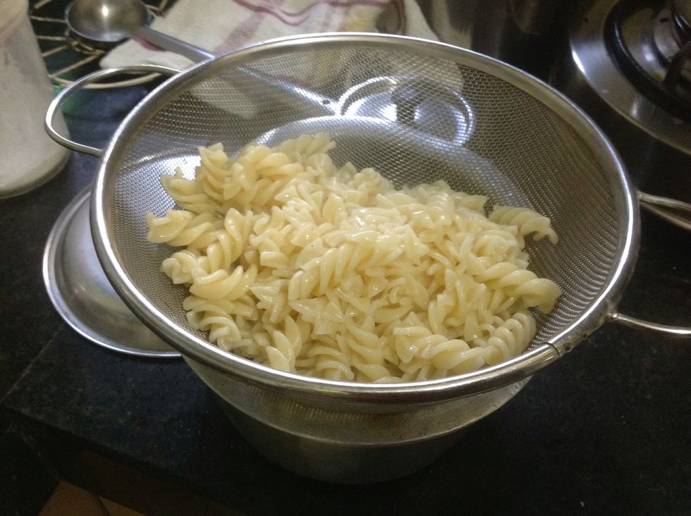 Meanwhile boil the spaghetti in water and do add salt to the water and then take it out. It should be boiled till it get softened. Should look like this.