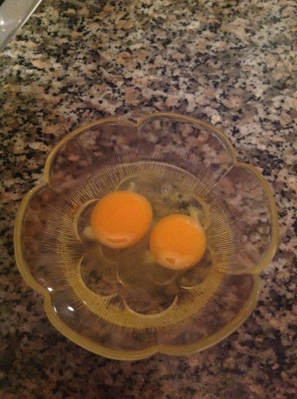 Meanwhile, break the eggs into a cup