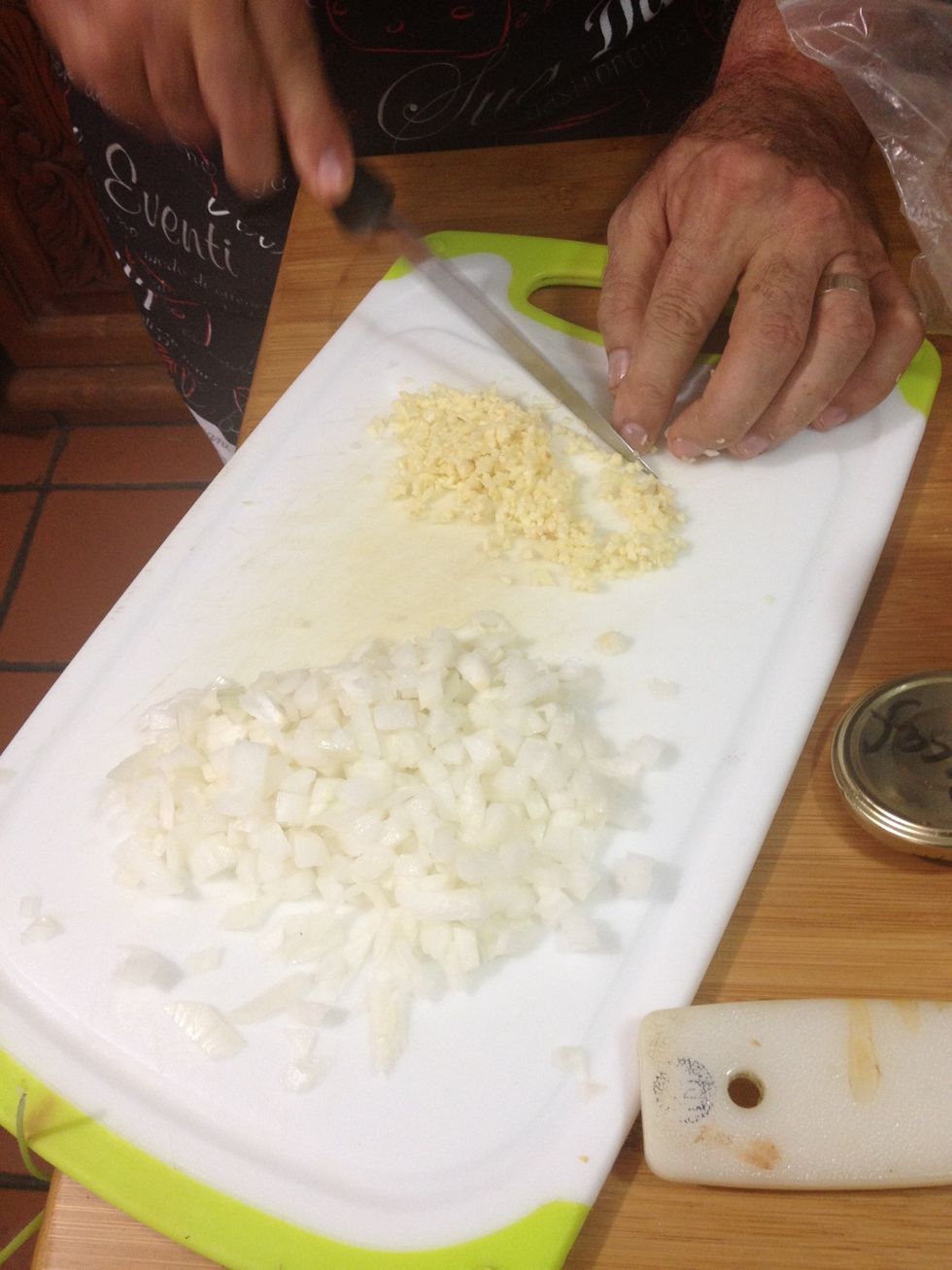 Meanwhile, chop the onion and garlics.