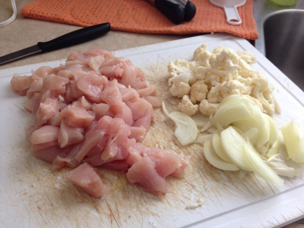 Meanwhile, chop up chicken, cauliflower and onion.