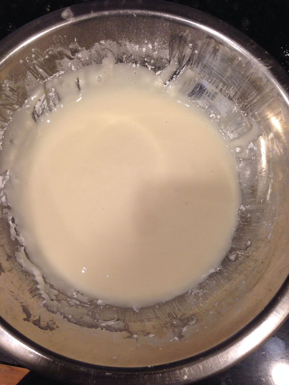Meanwhile, combine the corn syrup with the vanilla in a small bowl. Whisk in the powdered sugar and enough cream to make a thick glaze; set aside.