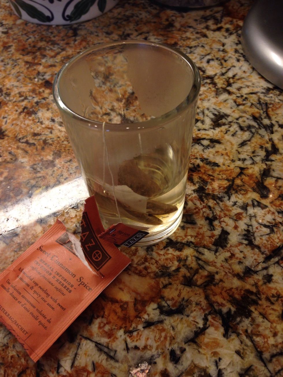 Meanwhile combine your 1/2 cup boiling water with your tea bag, (look at that you're brewing tea!)