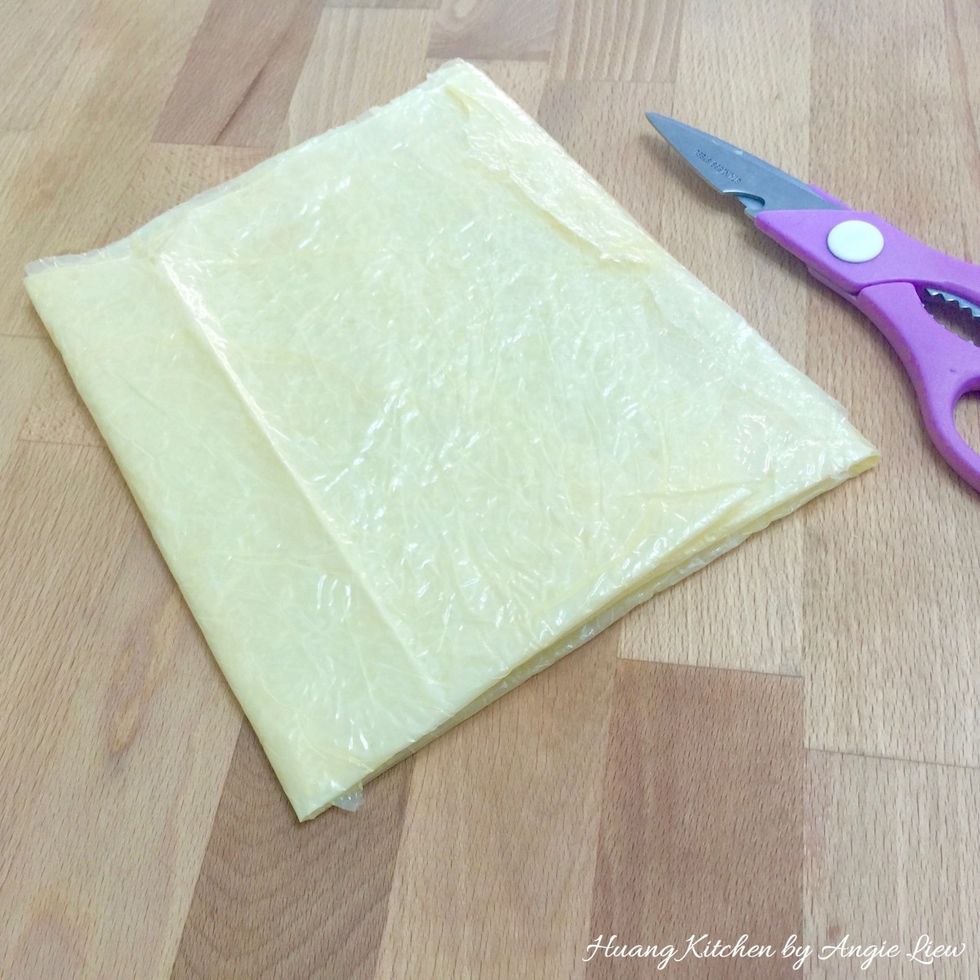 Meanwhile, cut the beancurd skin wrapper into equal pieces, big enough to wrap the marinated meat.