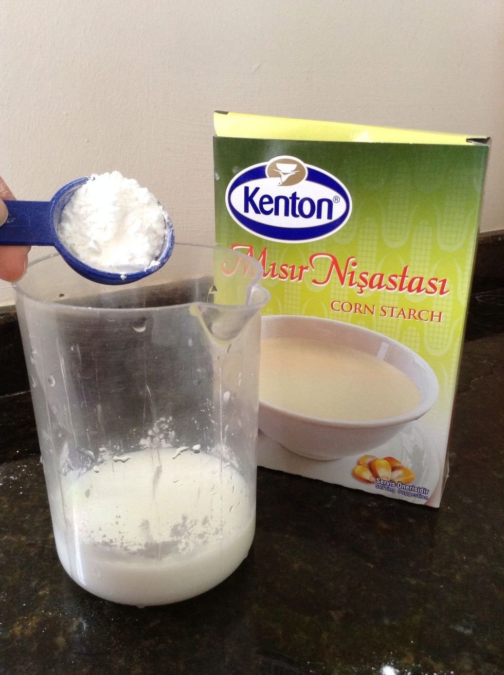 Meanwhile, dissolve the cornstarch in the remaining 1/4 cup milk.