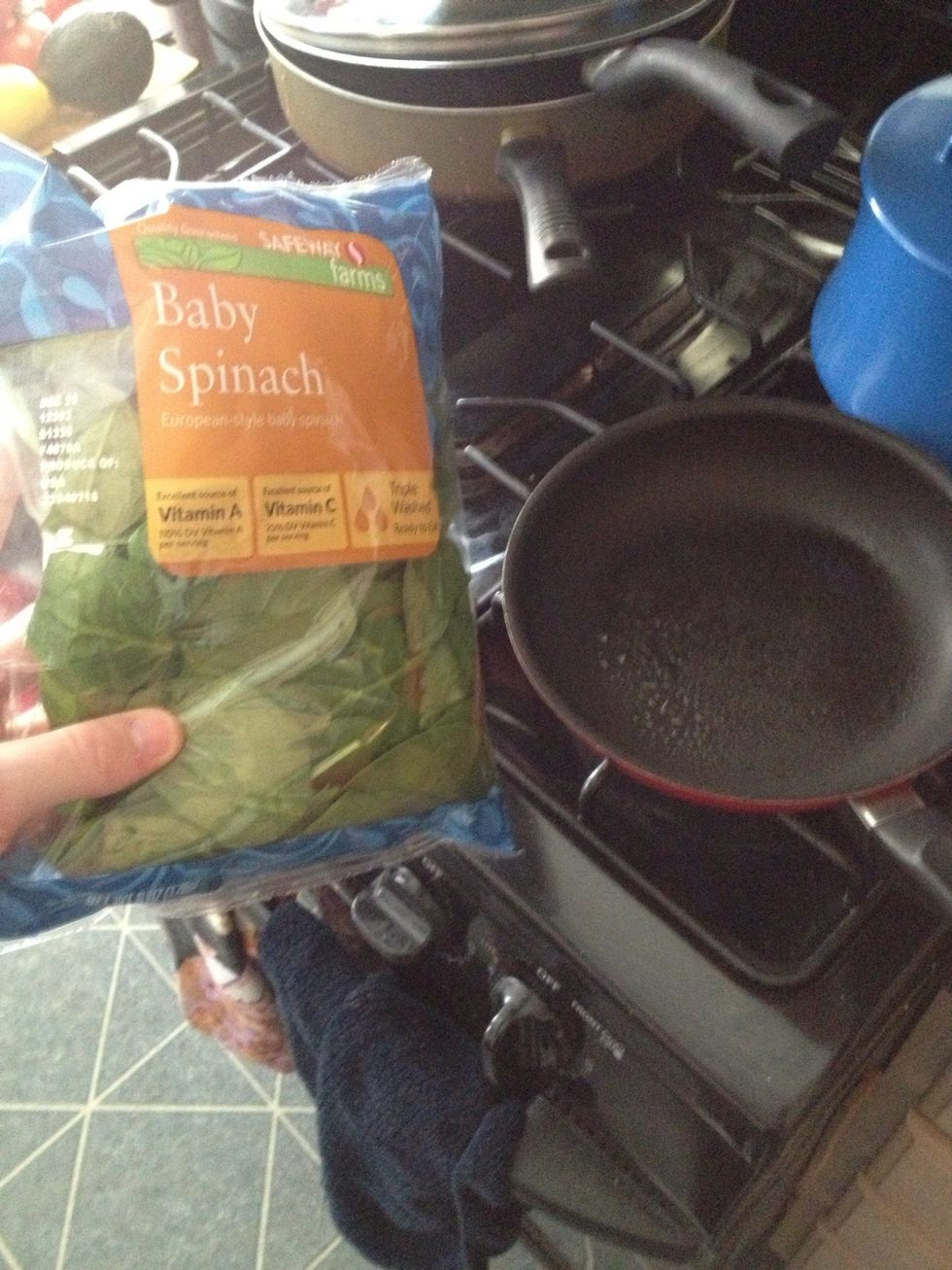 Meanwhile heat a pan to wilt the spinach in