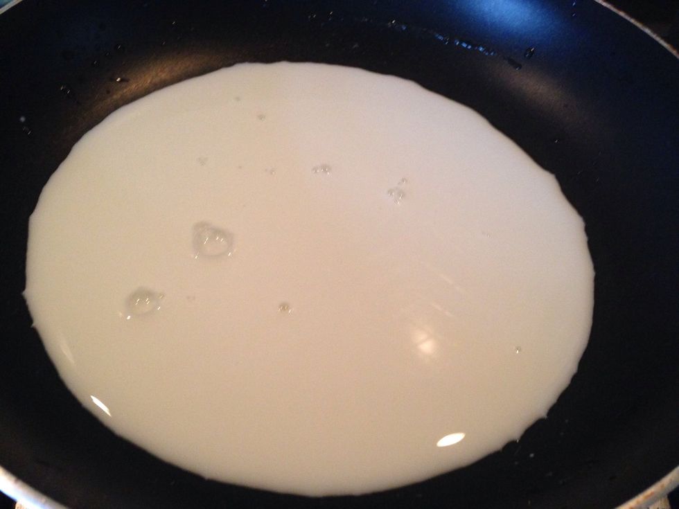 meanwhile in a pan prepare your ganache by adding milk to pan n heat it on medium heat