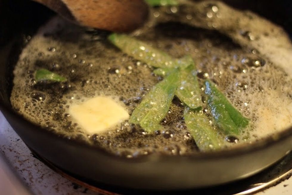 Meanwhile in a skillet, heat some butter. Heat it until you have browned butter, and toss in some fresh sage leaves. They'll sizzle and fry up fast.
