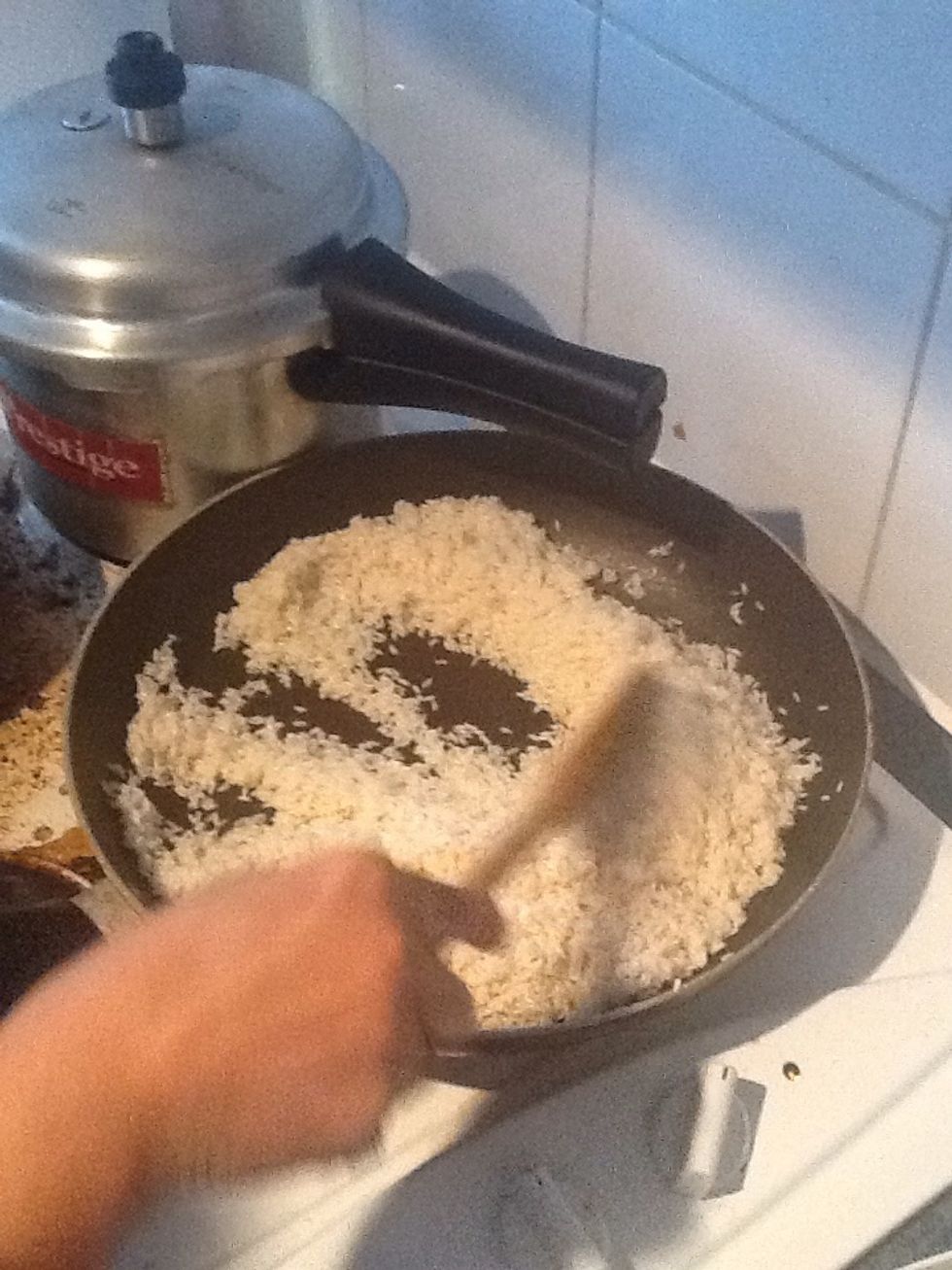 Meanwhile in another pan add 1tbsp of ghee....add bay leaves.remove water from the soaked rice and add it to the pan and fry until golden brown.keep stirring continuously.
