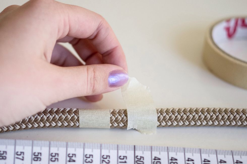 Meanwhile measure your rope, and tape it down before you cut, to prevent from fraying.