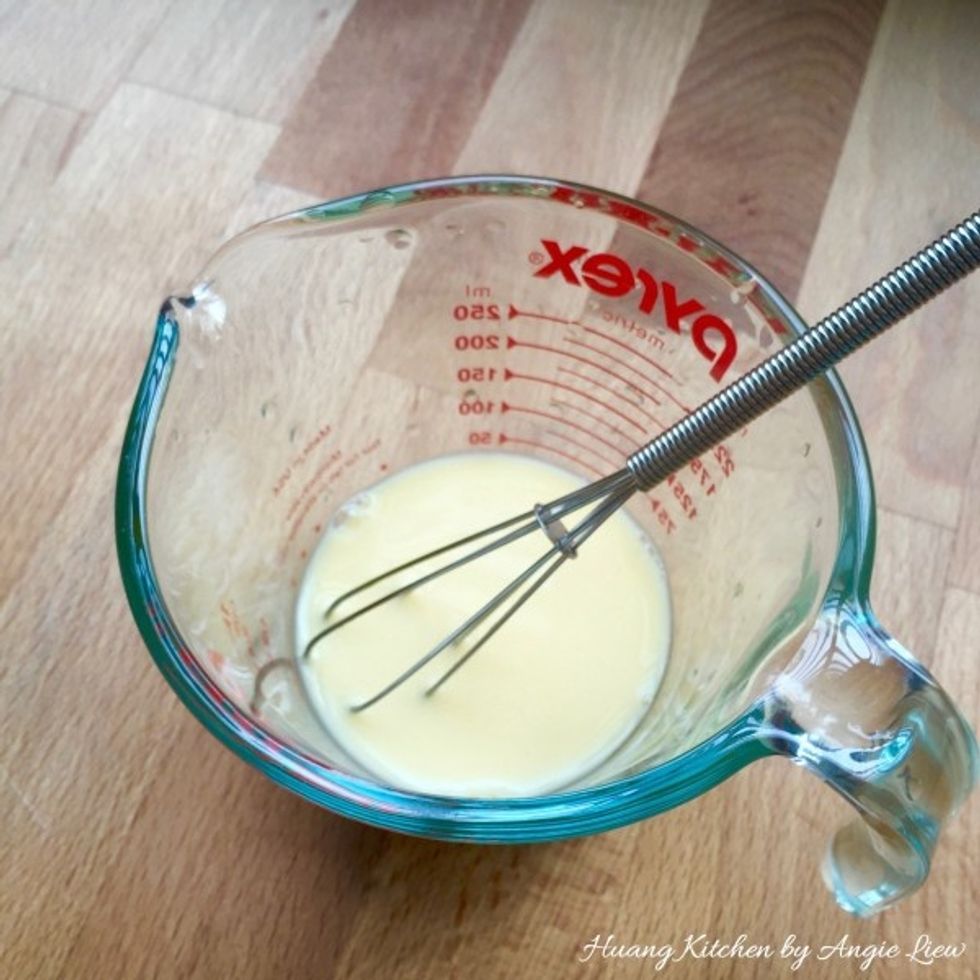 Meanwhile, mix together the egg yolk and ice cold water.