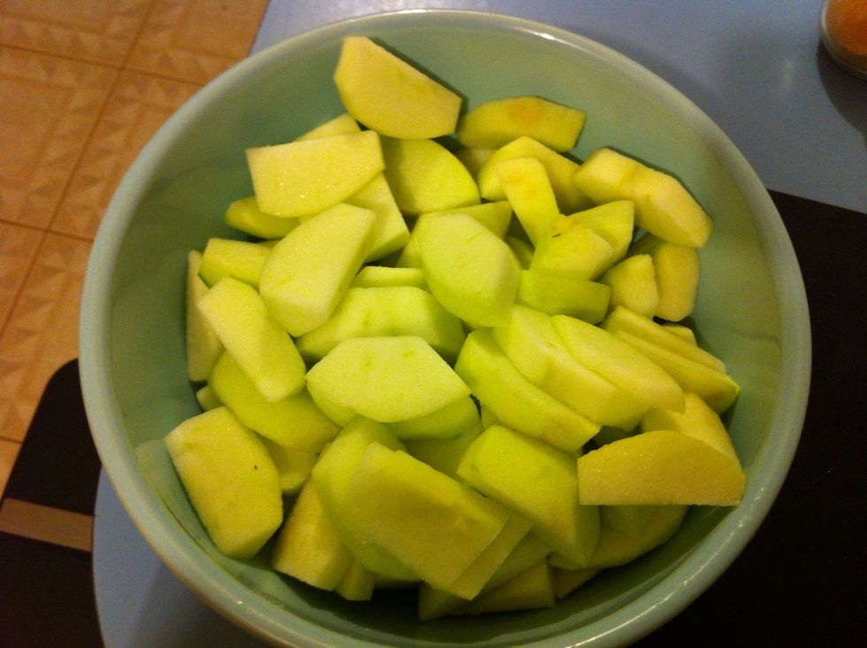 Meanwhile peel, core and slice apples.