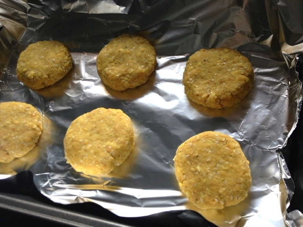 Meanwhile preheat the oven to 350. Line up your patties on foil.