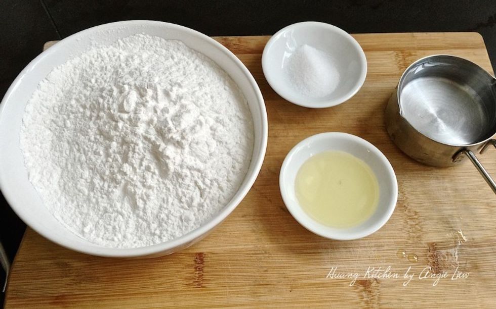 Meanwhile, prepare ingredients needed to make the yam abacus seeds which are tapioca flour, cooking oil, salt and hot boiling water.