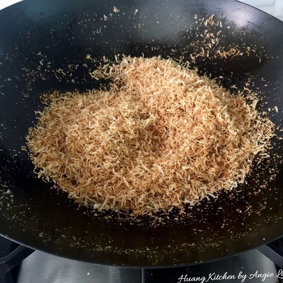 Meanwhile, prepare kerisik by dry frying freshly grated coconut under medium low heat until it is well toasted and turn brown and aromatic, about 10 minutes.