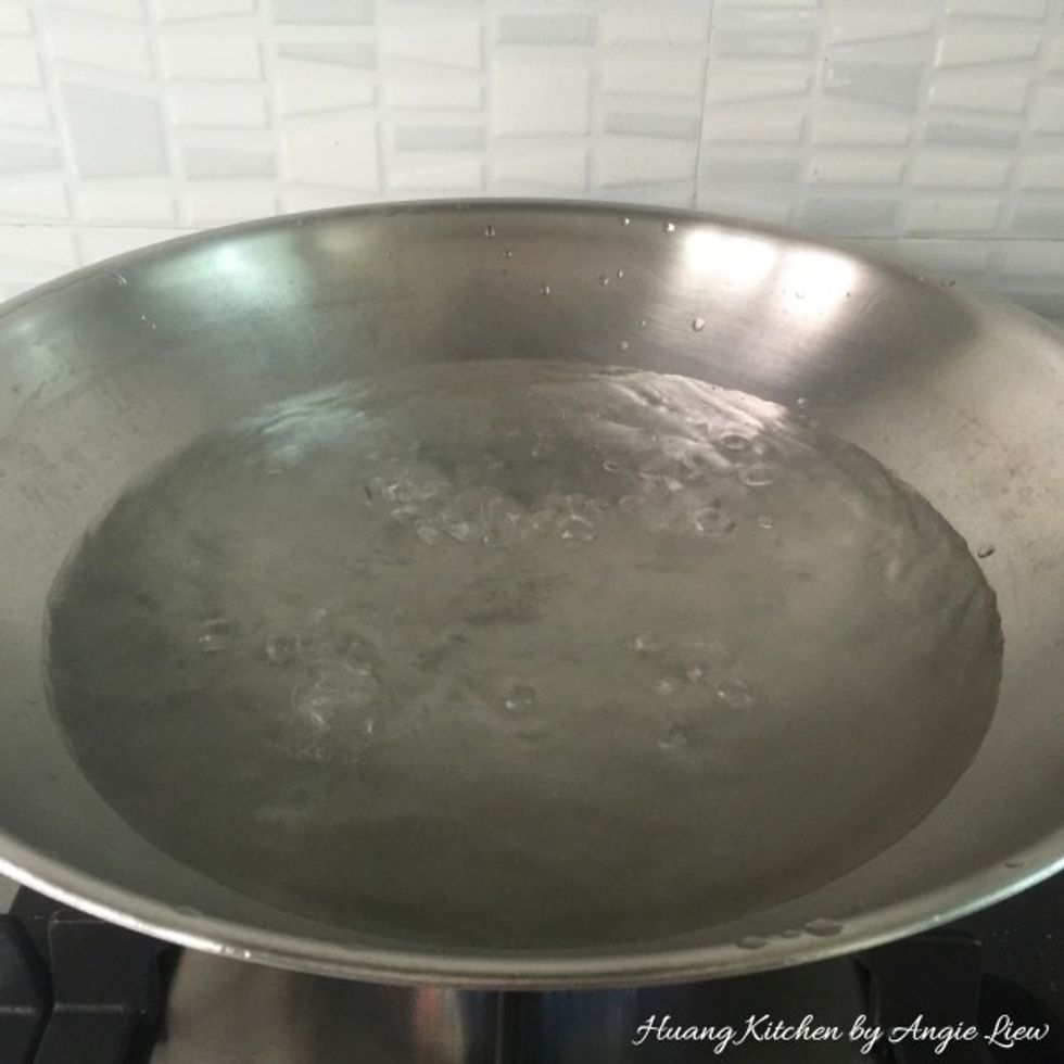 Meanwhile prepare steamer to steam the bun by heating up water in a wok. Bring the water to a boil.