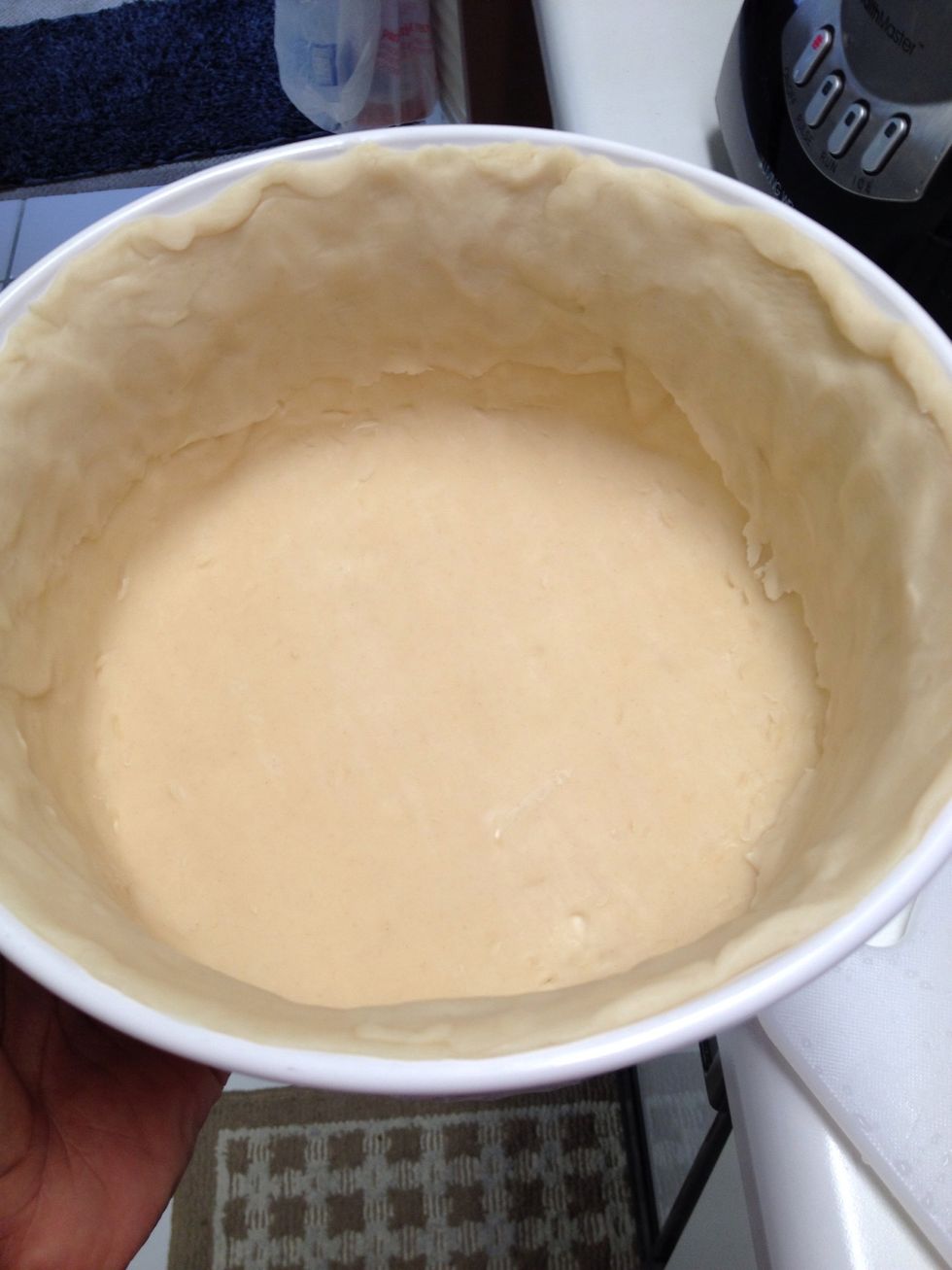 Meanwhile prepare your baking dish with the pie crust. Press against sides to cover dish. Poke a couple of holes with a fork in the bottom and sides of crust. Bake crust in 350degree oven a bit. 5 min