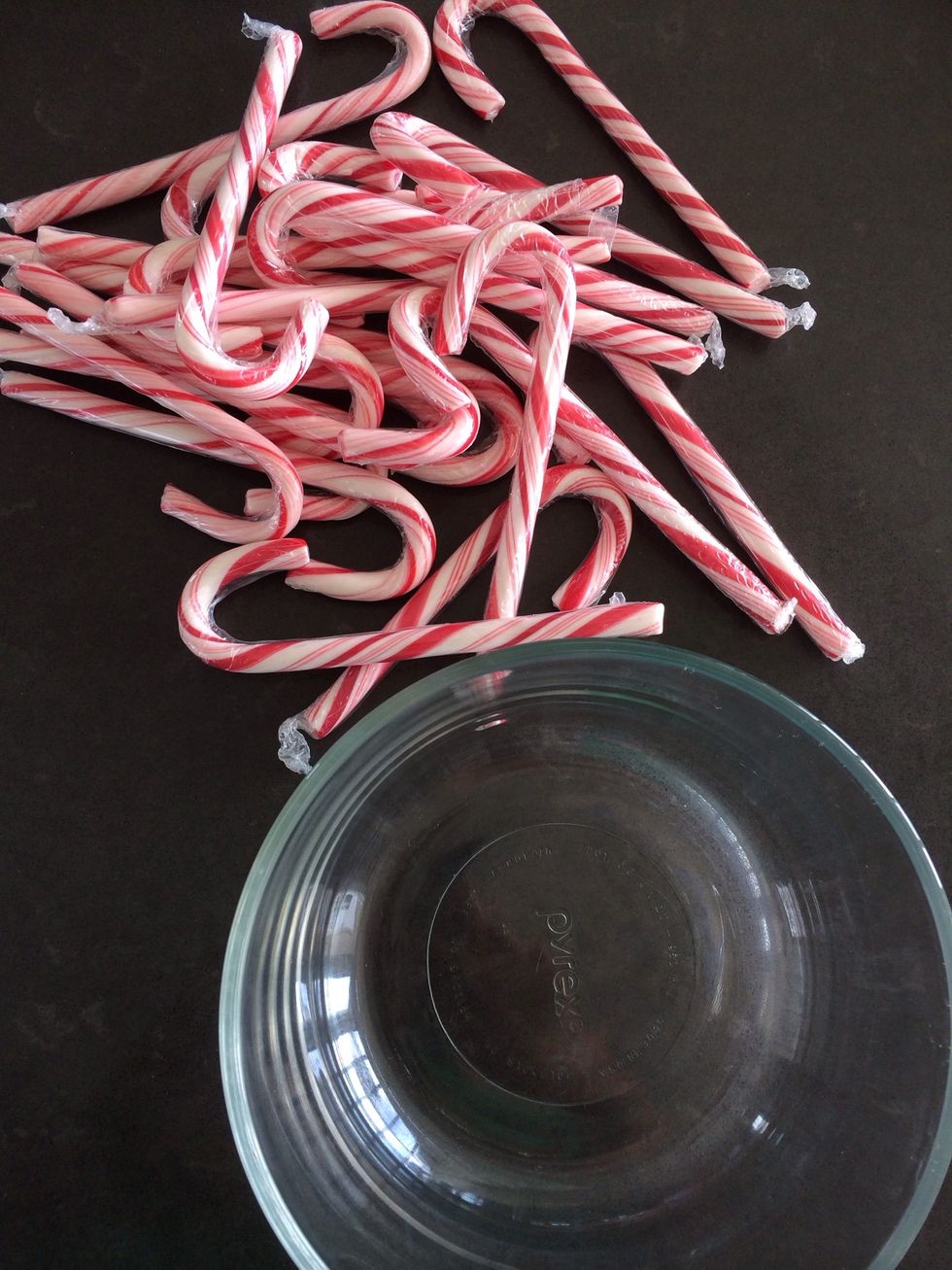 Meanwhile, put candy canes into a bowl and smash them with a spoon.
