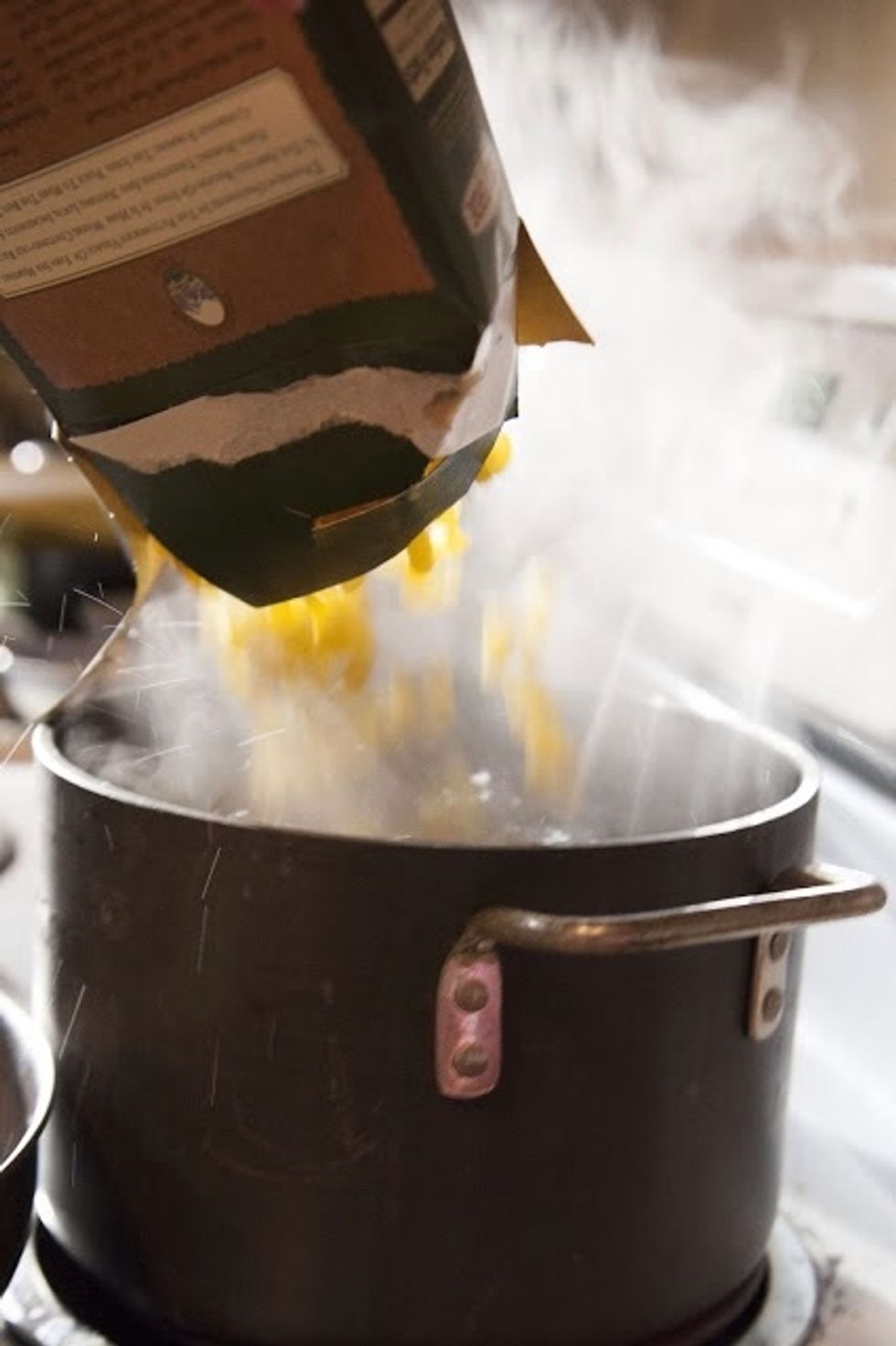 Meanwhile put the pasta into the boiling water. Cook the pasta for 7 minutes. It should still be al dente as it's going to be cooked further in the oven. Then drain it and set it aside.