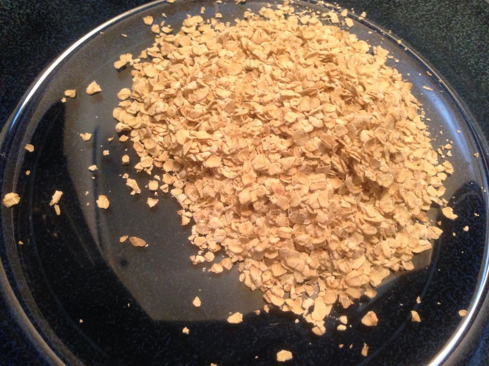 Measure 1/2 cup of gluten free rolled oats and pour in a bowl