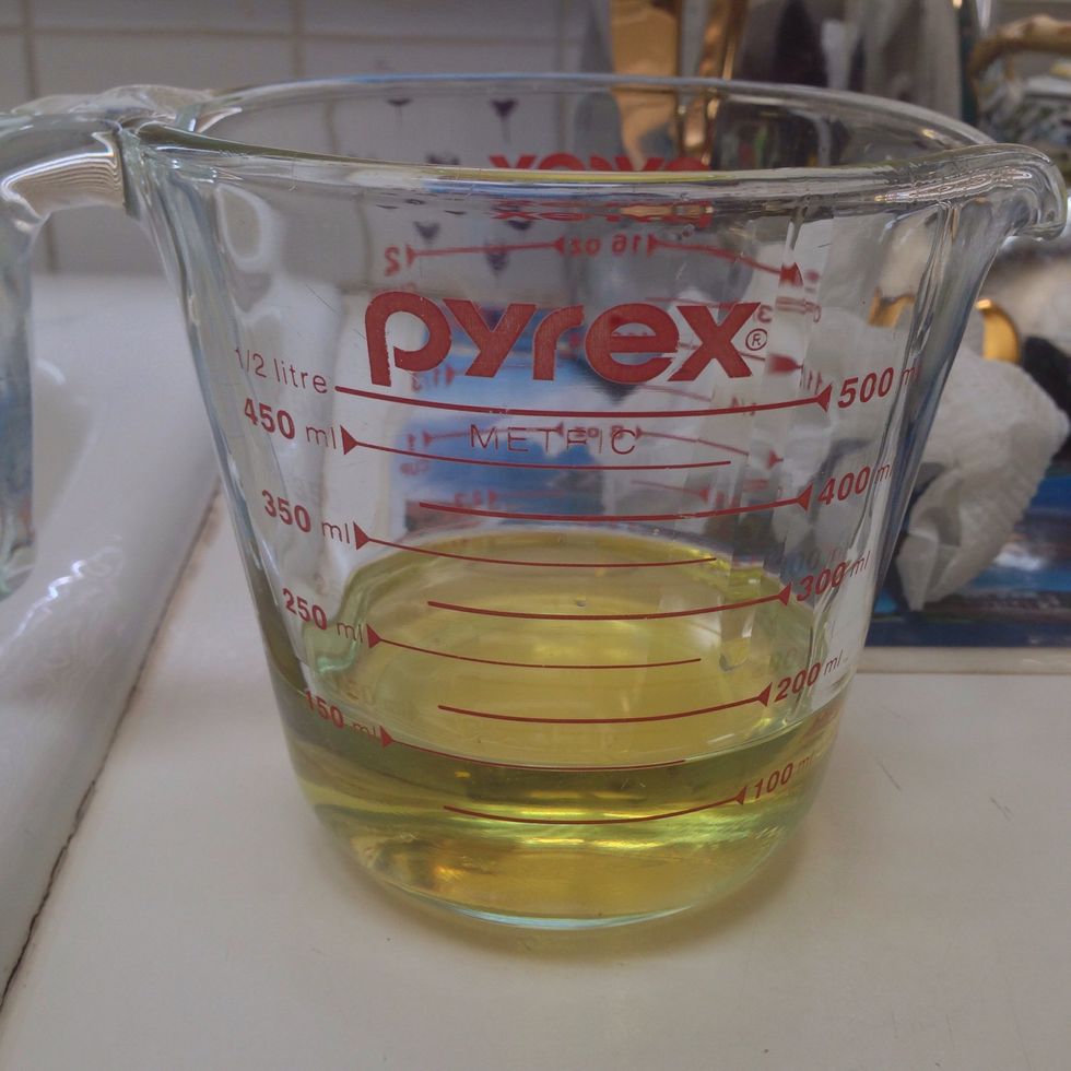 Measure 1/2 cup of olive oil.