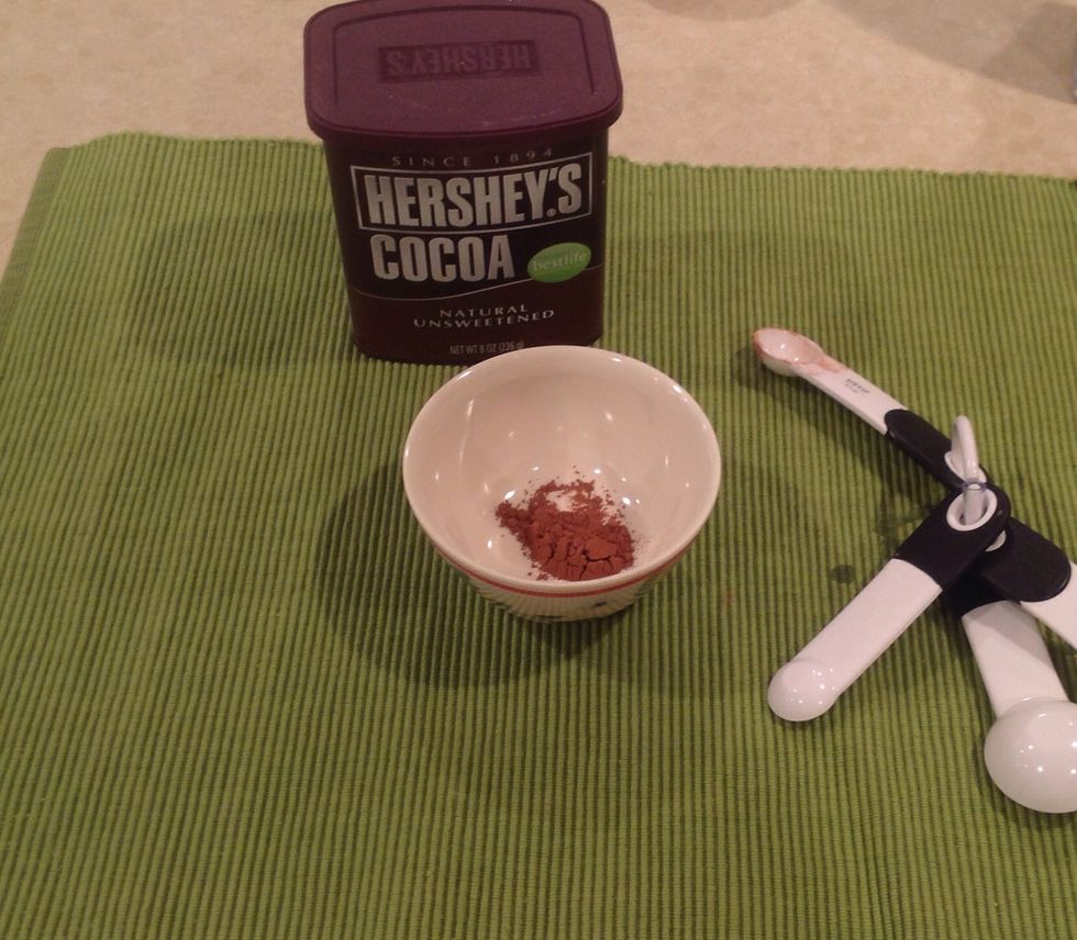 Measure 1/2 teaspoon cocoa into separate bowl.