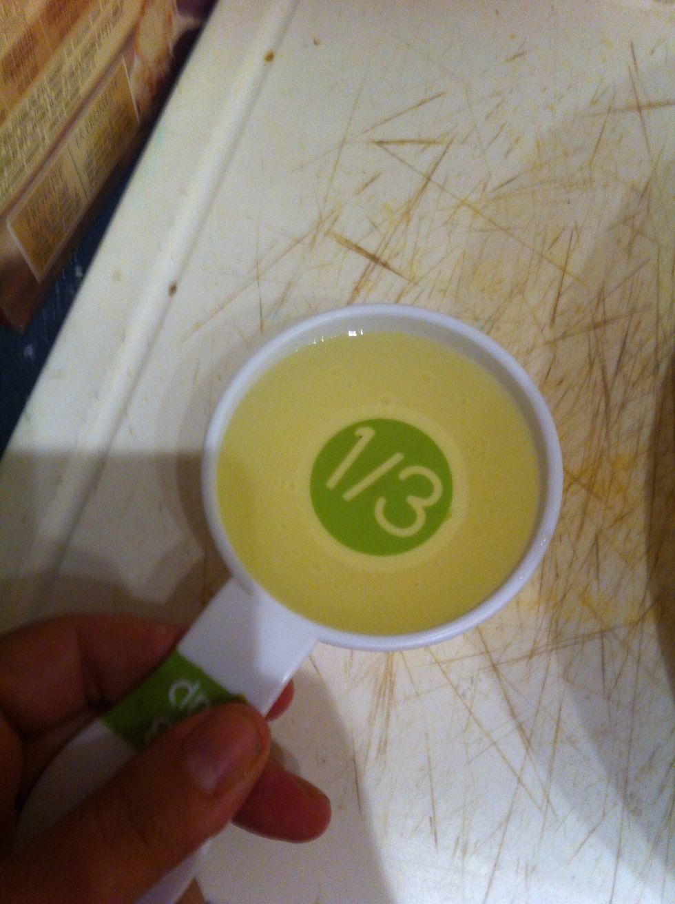 Measure 1/3 cup of canola oil and pour in bowl of mix