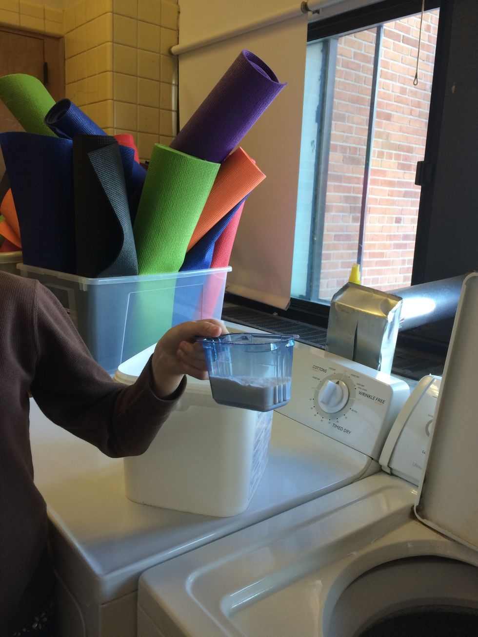 Measure 1/3 cup of detergent