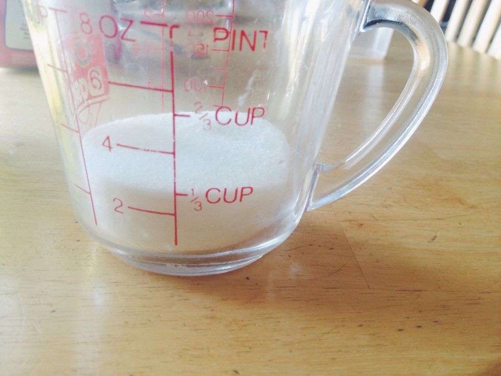 Measure 1/3 cup of sugar and pour it into a bowl.