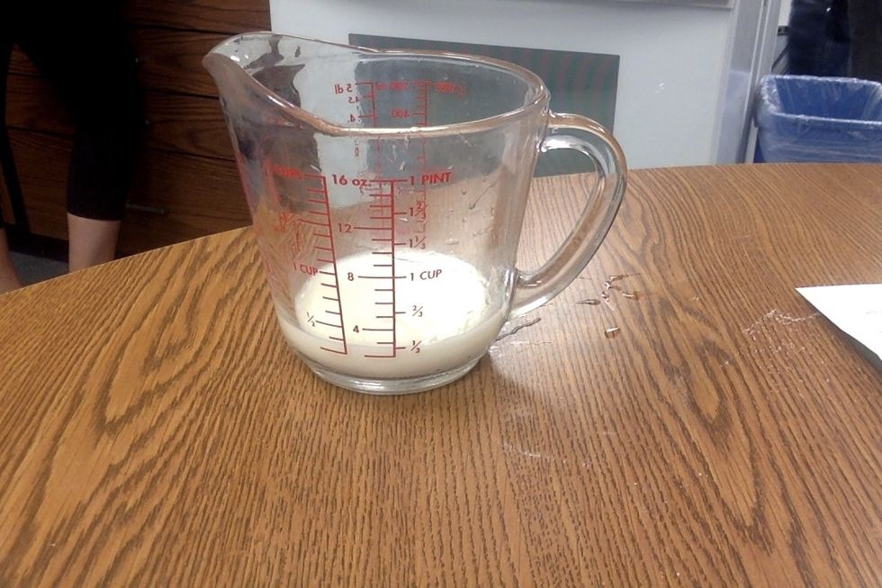 Measure 1/4 cup of milk, at room temperature.