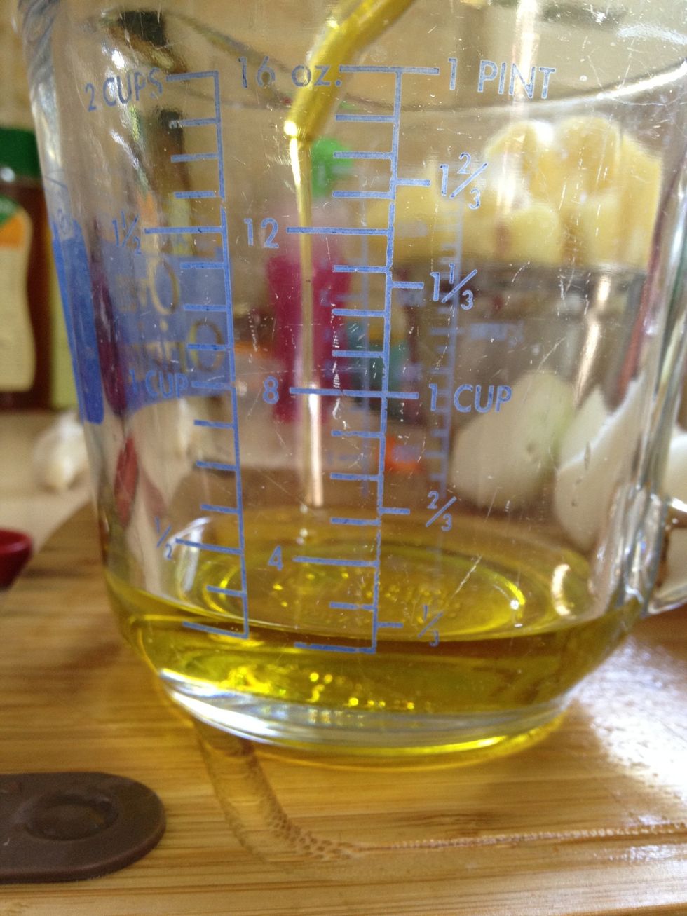 Measure 1/4 cup of olive oil