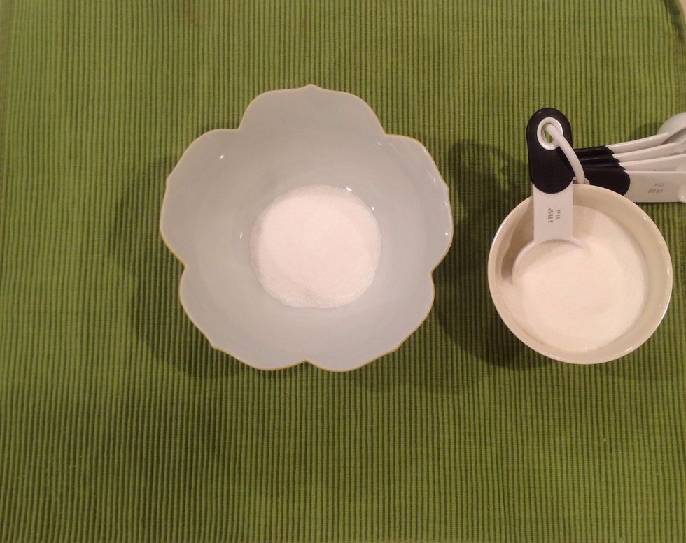 Measure 1 tablespoon sugar into bowl.