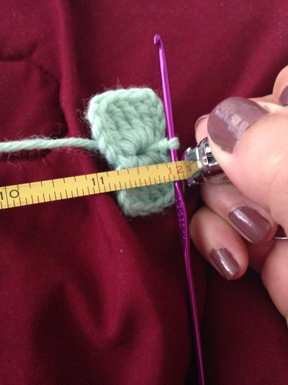 Measure 12 inches of extra yarn and cut leaving a 12 inch tail.