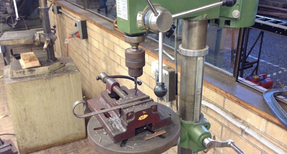 Measure 1cm out from the end and drill a hole