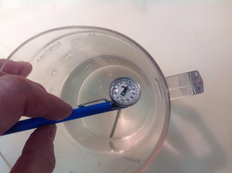 Measure 2 cups of lukewarm H2O. Don't go above 110F. If you don't have a thermometer, run your finger under the tap, your body temp is 98(ish), so you'll be able to feel when it's hotter or colder.