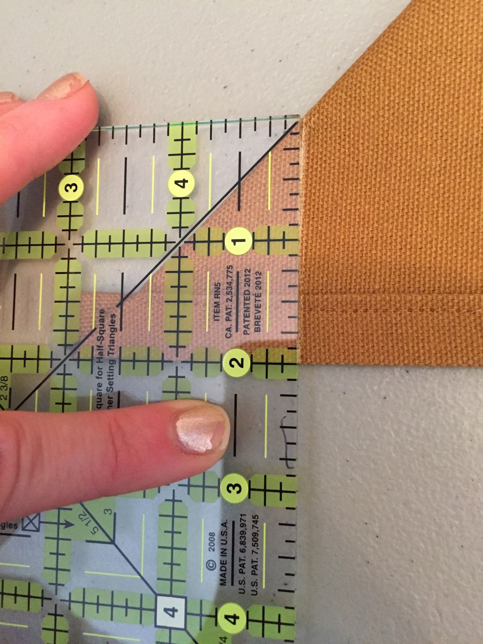 Measure 2 inches from corner and draw a line. (The line drawn should measure 2in)