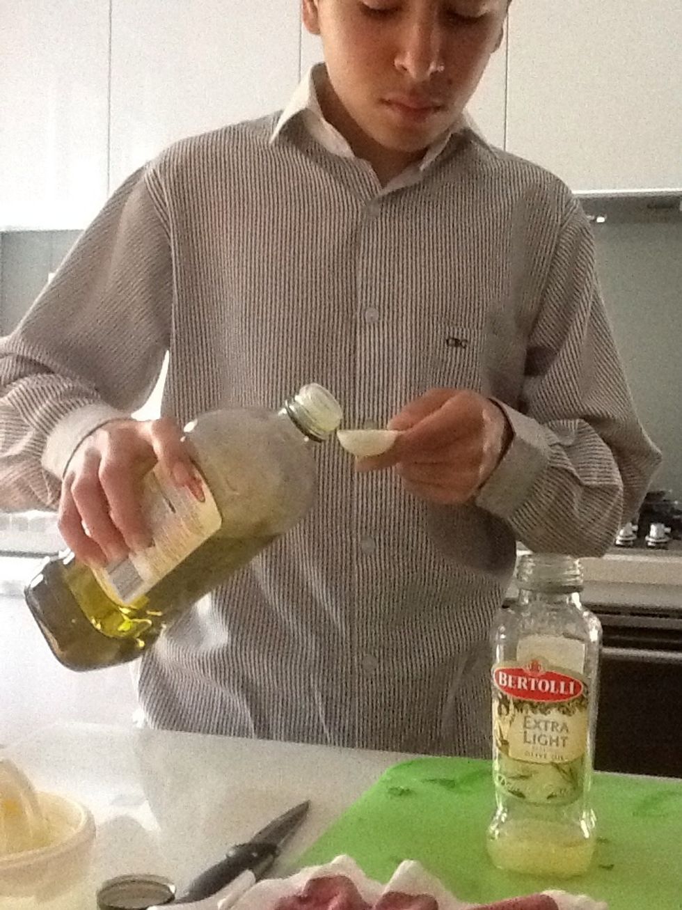 Measure 2 tablespoons of Extra Virgin olive oil and add to screw-top jar.