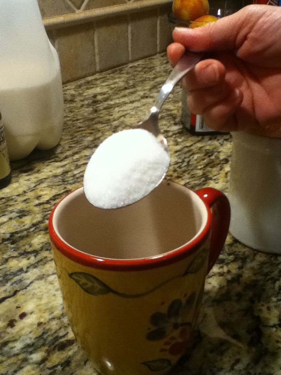 Measure 2 tablespoons of sugar and put into mug