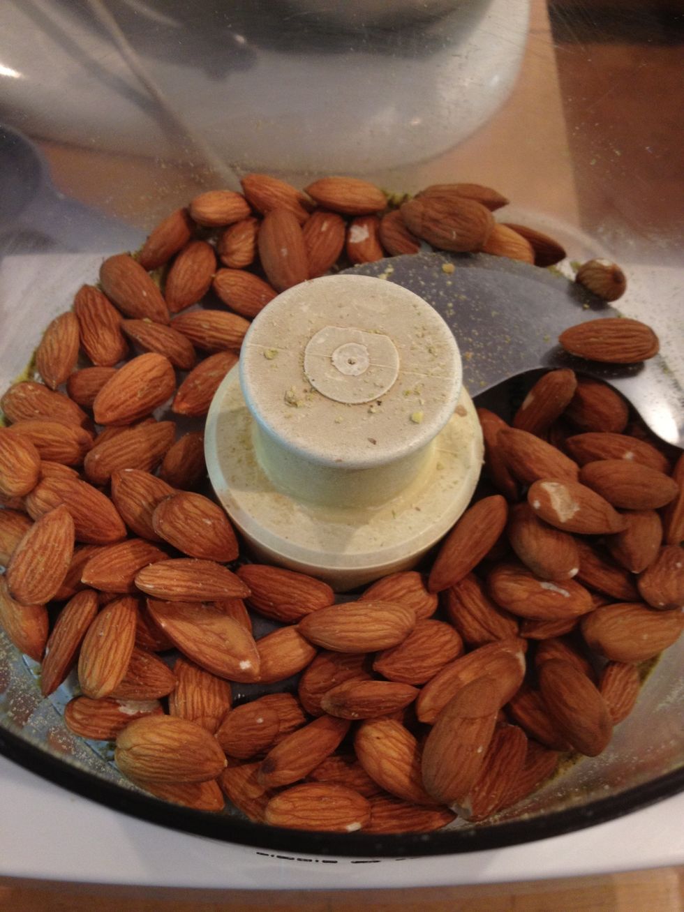 Measure 3/4 cup of almonds into the cuisinart.