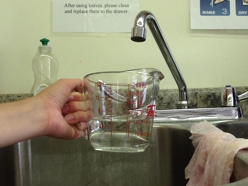 Measure 3/4 cup of hot water