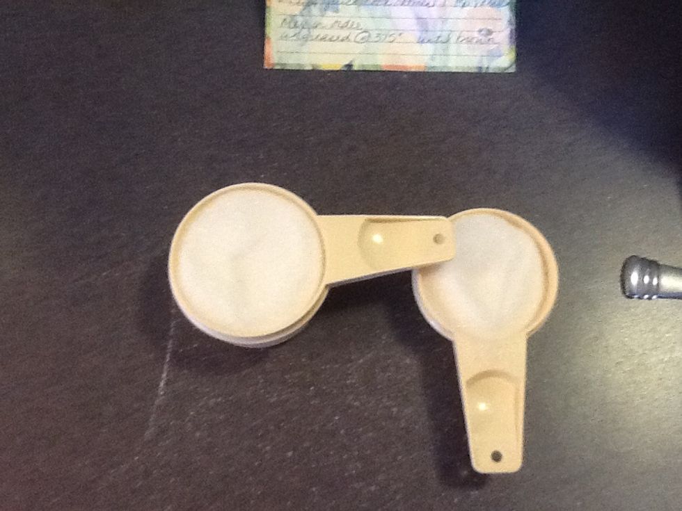 Measure 3/4 cup of sugar, and add to mixing bowl.